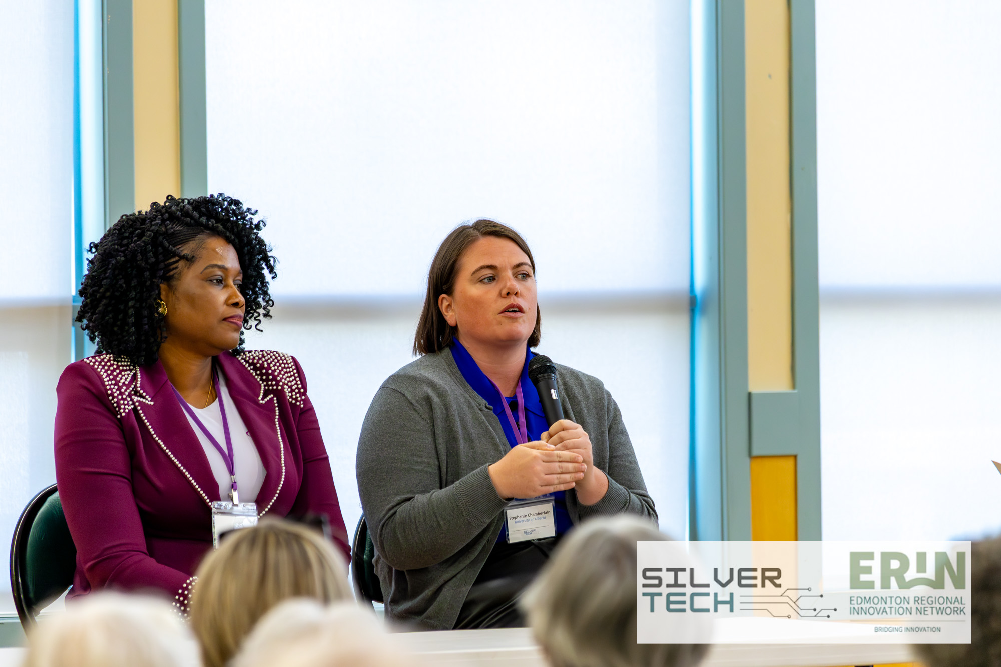 Two panellists speaking to the audience during a SilverTech Summit panel