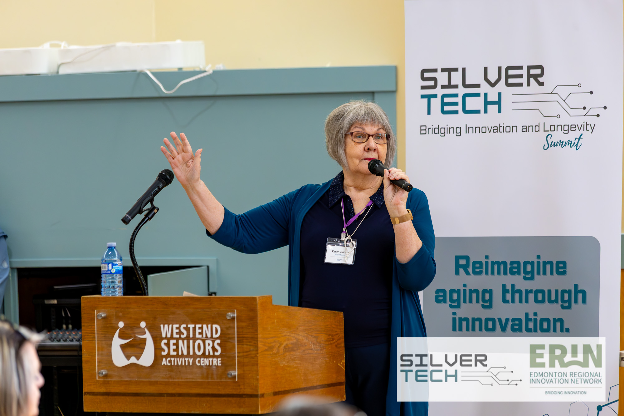 Karen Murray speaking at the SilverTech Summit podium