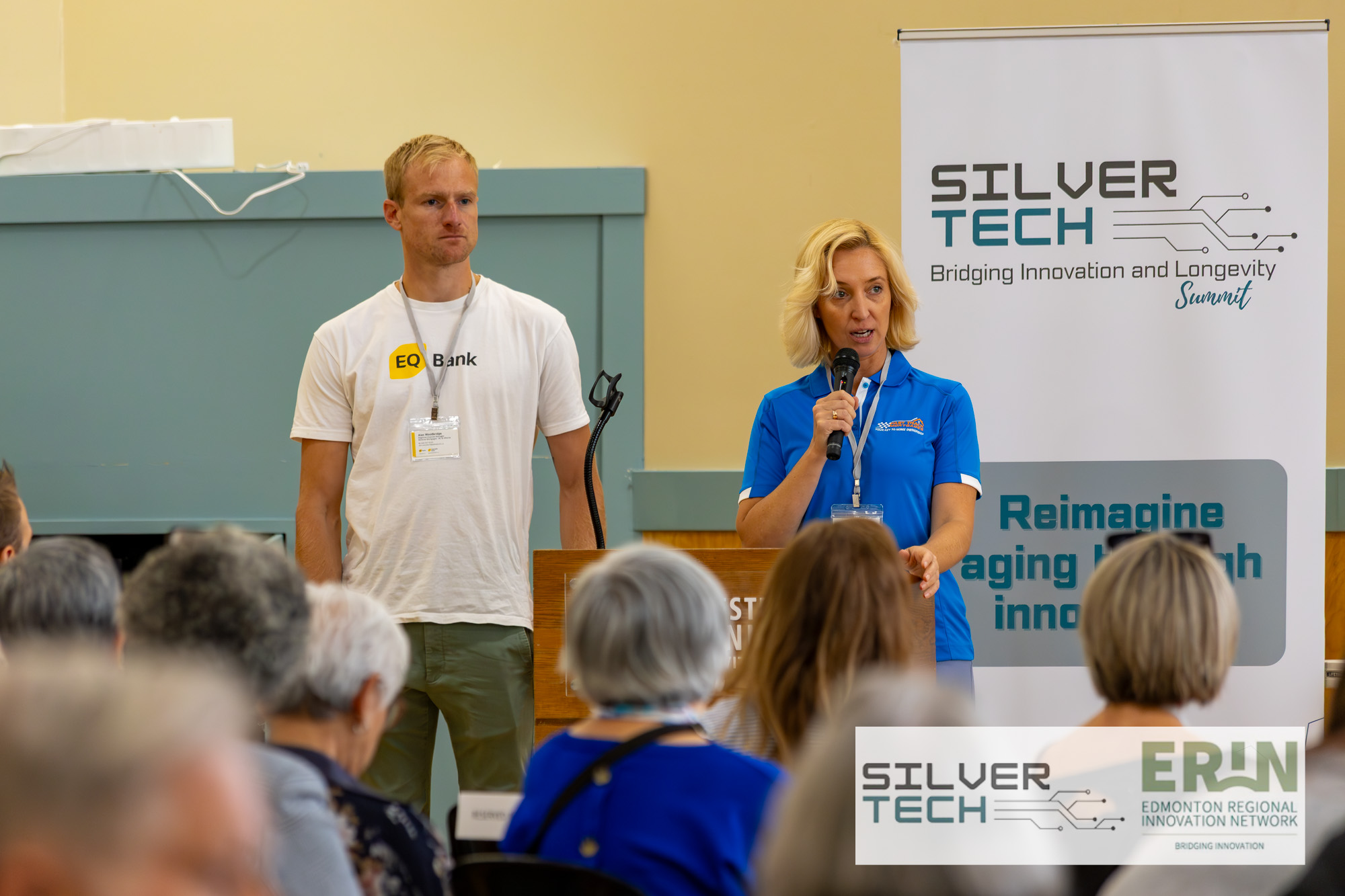 Two presenters sharing the stage during a SilverTech Summit talk