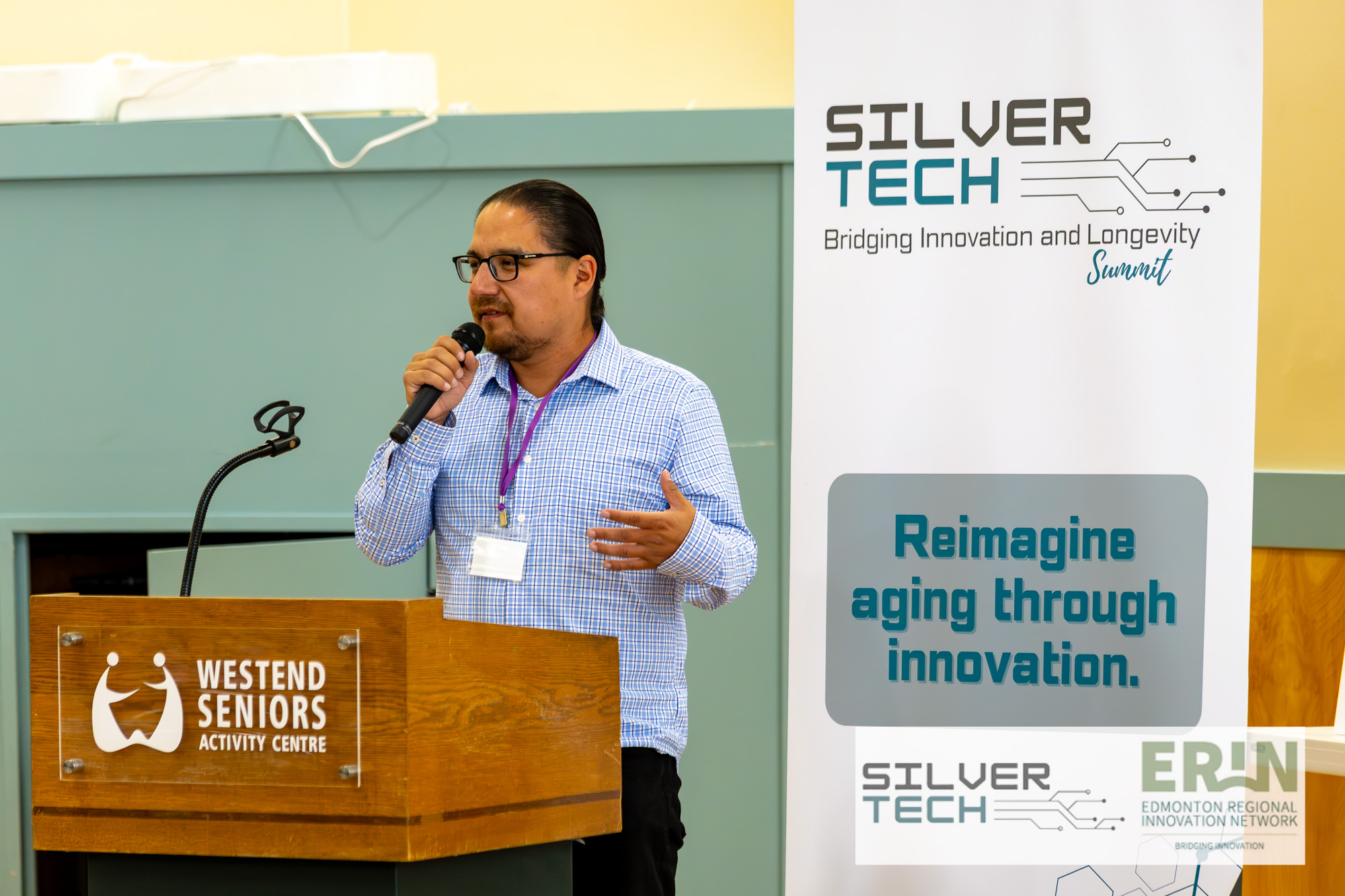 Speaker at the podium addressing the SilverTech Summit 2025 audience